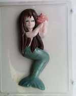 Large Mermaid holdi...